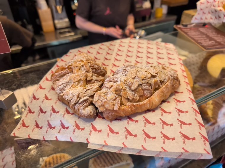 Almond croissant dusted with flaked almonds